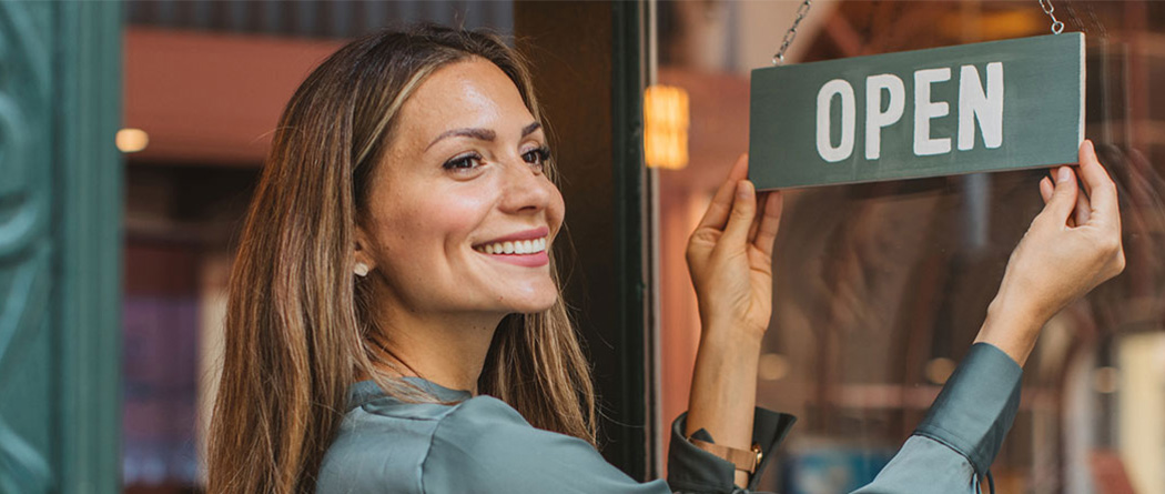 commercial remodel business woman and open sign