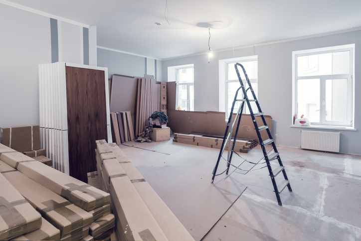 commercial remodel in progress with ladder and materials