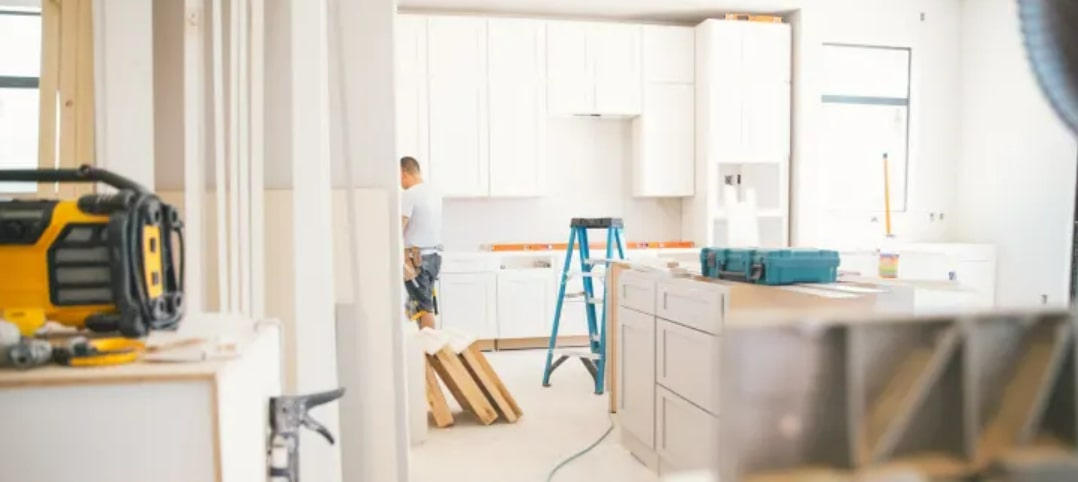 Kitchen worker remodeling home