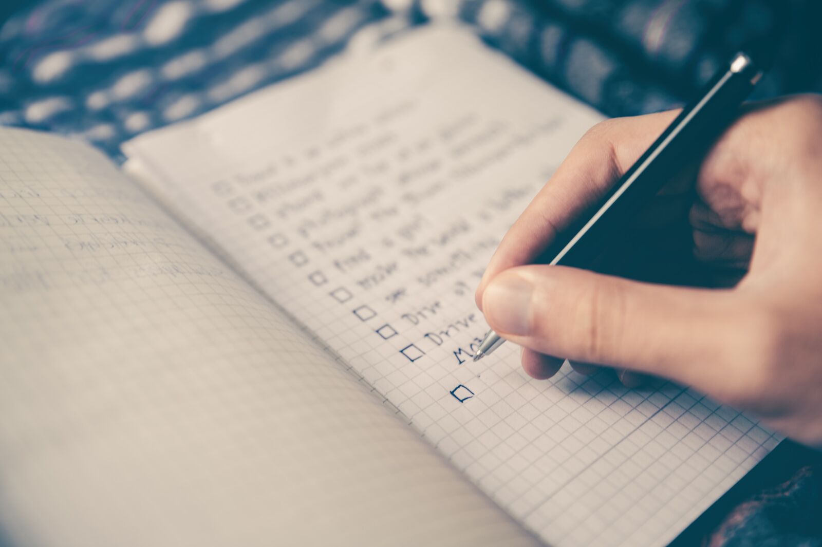Male hand with pen creating check boxes