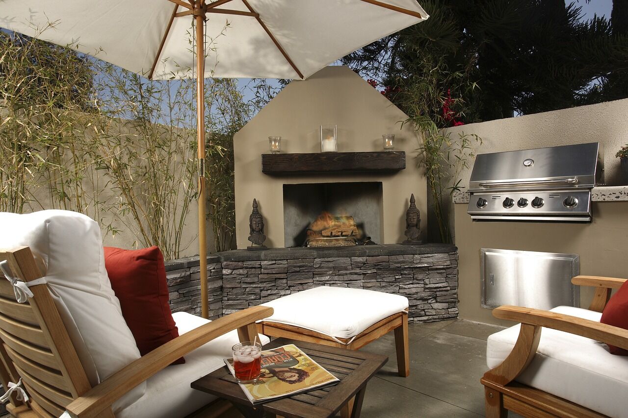 outdoor living space with seating, fireplace, and grill