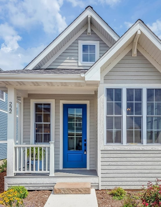 Beige starter home with blue door