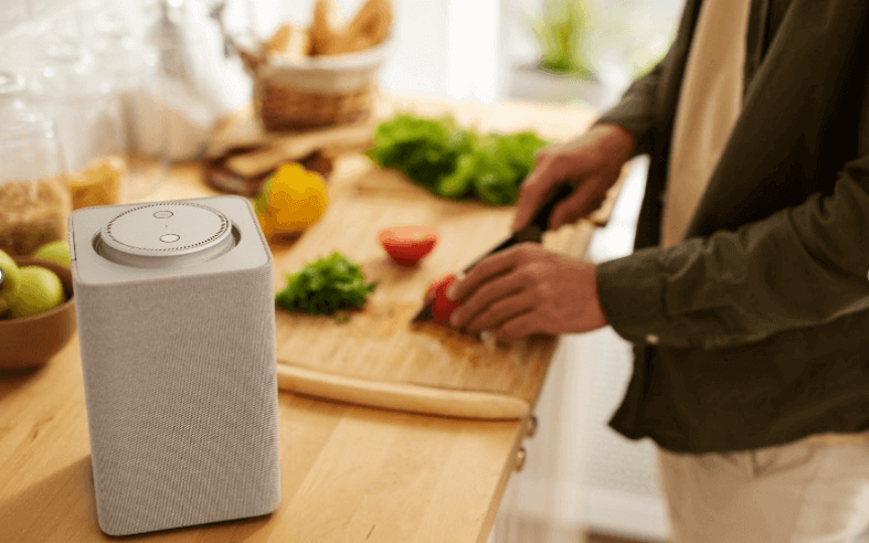 smart home kitchen comfort device while person cutting veggies on counter
