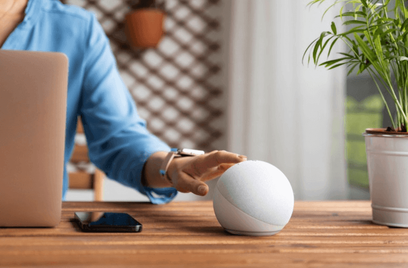 what is a smart home with activated assistants (woman hand touching device)
